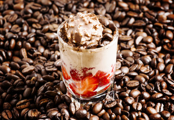 Coffee and chocolate dessert with ice cream and strawberries, se