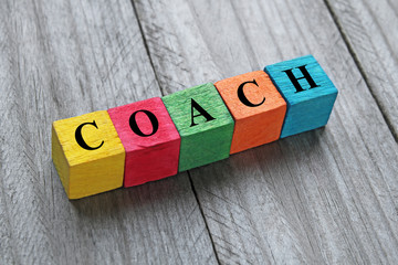 word coach on colorful wooden cubes - obrazy, fototapety, plakaty