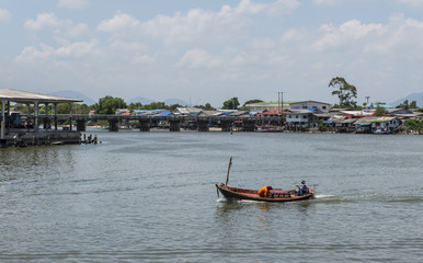 Fototapeta na wymiar Moving Traditional fisherman boat, Thailand.