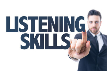 Business man pointing the text: Listening Skills