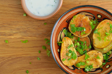 Baked potatoes with herbs, top view.