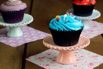 Assortment of cupcakes on a rustic wooden table