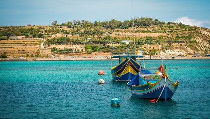 Fototapeta na wymiar fishing boats near village of Marsaxlokk 