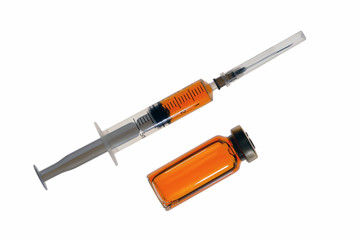 Fototapeta premium Plastic disposable syringe with medicine and a glass bubble with