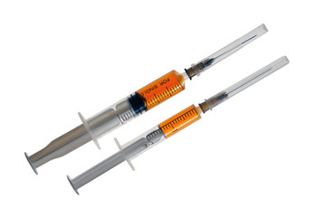 Fototapeta premium Two plastic disposable syringes with a needles in a protective c