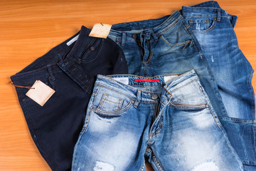 Pile of Blue Jeans in Various Washes and Styles