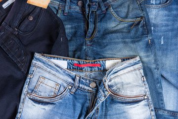 Pile of Blue Jeans in Various Washes and Styles