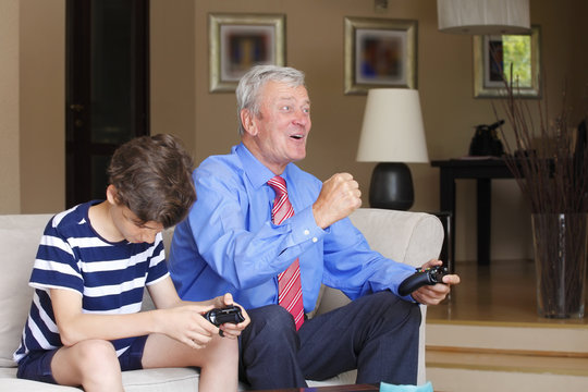 Grandfather And Grandson Playing Together