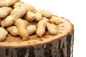 Pile of unshelled peanuts, isolated on white background