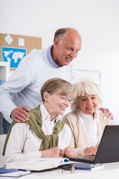 Retired people using laptop