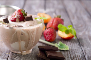 Chocolate ice cream with coffee bean and strawberry