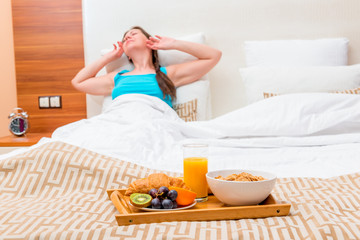 awakening and breakfast tray on the bed