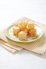 Chewing Turkish sweets on a plate