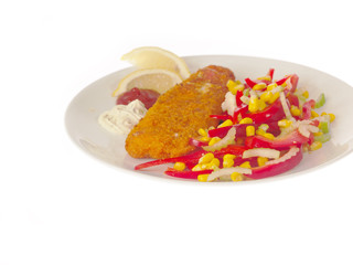 fried breaded fish with sweet corn, celery and paprika salad