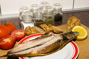 smoked fish on a plate with garnish