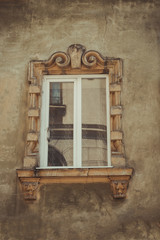 Old window with bas relief