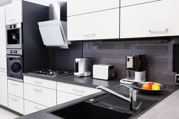 Modern luxury custom hi-tek black and white kitchen, clean interior design