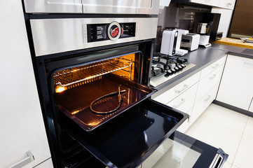 Modern hi-tek kitchen, oven with door open
