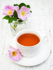 Cup of tea and dogrose