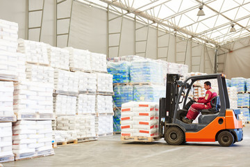 forklift loader working in warehouse 