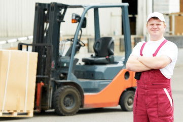 warehouse worker in front of forklift