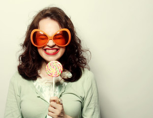 young happy woman with big orange sunglasses