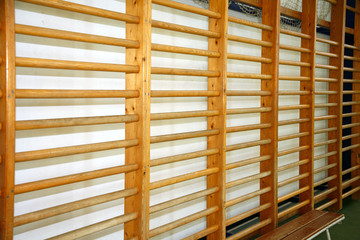 Closeup of wall bars in a high school gymnastic hall
