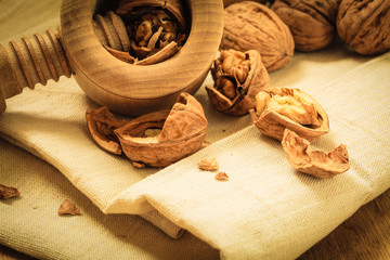 Walnut with nutcracker on rustic table