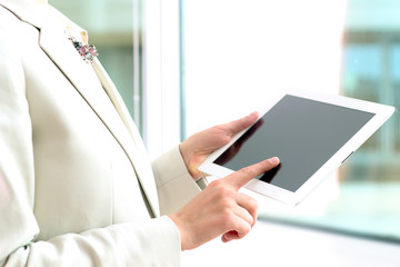 Business woman working with a digital tablet