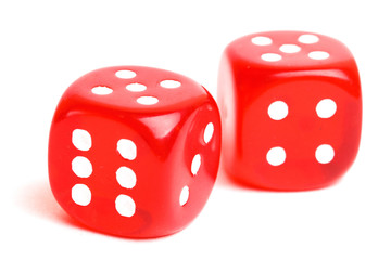 rolling red dice isolated on white