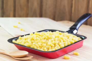 pasta on pan on wood table