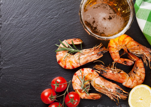 Beer mug and grilled shrimps