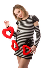 Pregnant women holding read hearts