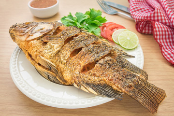 Fried fish on white plate and dip sauce