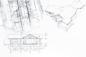architectural drawing with rolls of blueprints