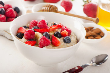 Oatmeal porridge with fresh Berries for  Healthy Breakfast.