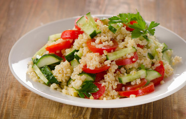 Tabbouleh salad with bulgur, parsley and fresh vegetables.
