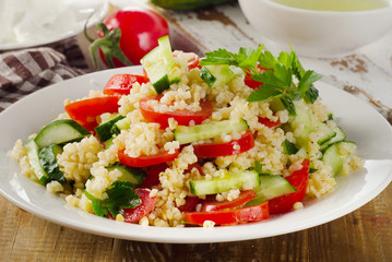 Salad with bulgur, parsley and vegetables.