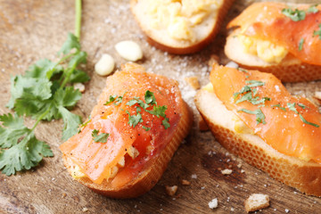 Scrambled eggs with smoked salmon, on baguette toast