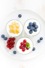 dietary product - assortment yogurt with fresh berries in glass