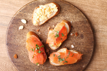 Scrambled eggs with smoked salmon, on baguette toast