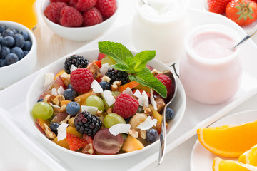 fruit salad in a bowl and various yoghurt