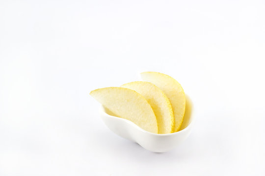 Asian pear slice in heart shape bowl on white background