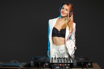 Beautiful blonde DJ girl on decks - the party,