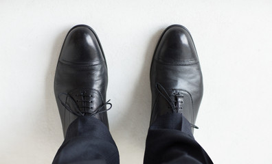 close up of man legs in elegant shoes with laces