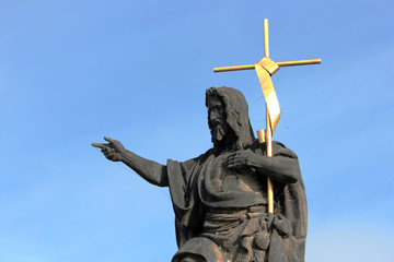 Statue of St. John the Baptist, the sculpture of Charles Bridge in Prague, Czech Republic