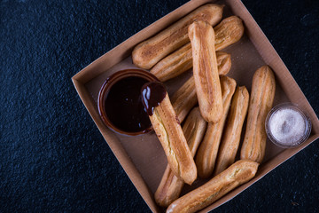 Street food latin churros with chocolate dip
