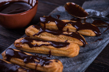 Decorating churros with hot chocolate dip