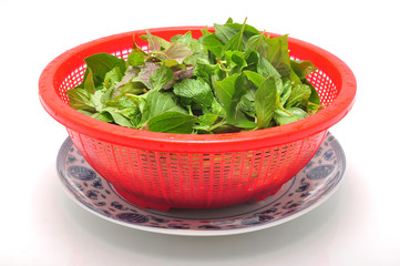 Vietnamese Basket of Herbs on a white background
