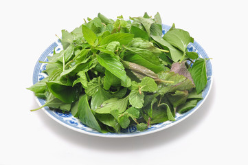 Vietnamese Basket of Herbs on a white background